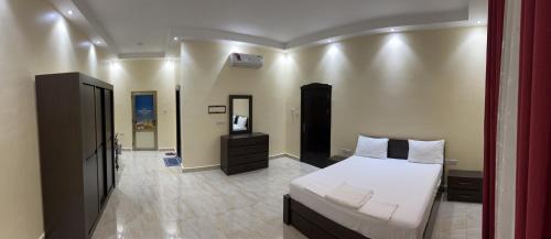 Un pat sau paturi într-o cameră la Maamuus Farmhouse