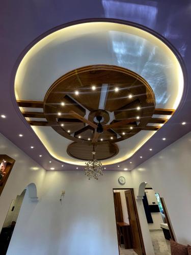 a ceiling with a ceiling fan in a room at Mangala Residency in Cola