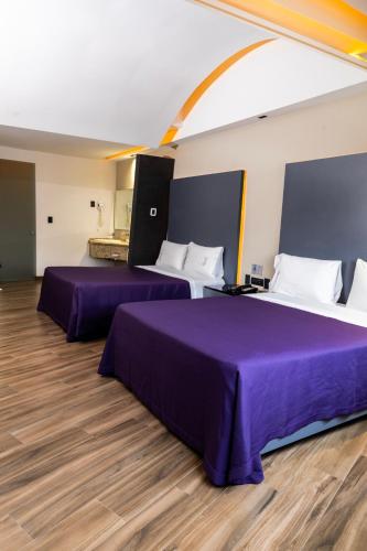 Ein Bett oder Betten in einem Zimmer der Unterkunft Hotel Aranjuez