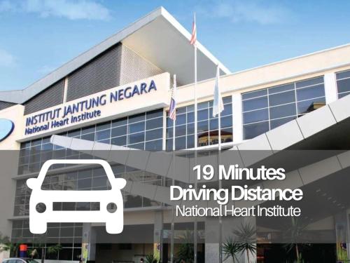 a building with a sign that reads minutes driving difference national heart institute at Seeds Hotel Premier Sri Petaling in Kuala Lumpur