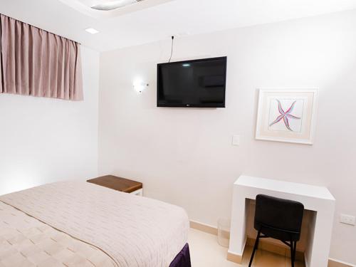 TV a/nebo společenská místnost v ubytování Muna Hotel