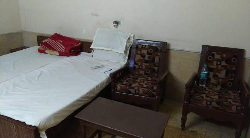 Postel nebo postele na pokoji v ubytování Muktinath Guest House