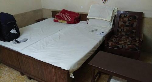 Postel nebo postele na pokoji v ubytování Muktinath Guest House