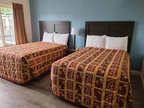 Ένα ή περισσότερα κρεβάτια σε δωμάτιο στο All Seasons Lodge