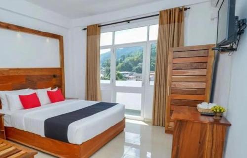 Ένα ή περισσότερα κρεβάτια σε δωμάτιο στο Kandy Grand Ocacia