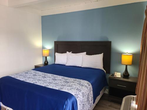 Ένα ή περισσότερα κρεβάτια σε δωμάτιο στο All Seasons Lodge