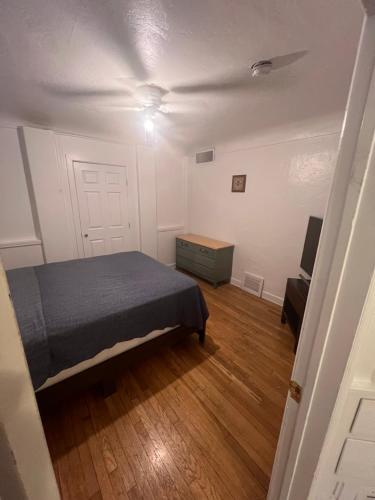 a bedroom with a bed and a dresser in it at Downtown Neighborhood Room 2 in Phoenix