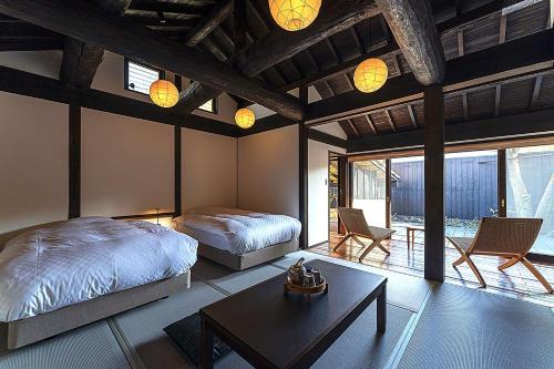 Una cama o camas en una habitación de Kyutei