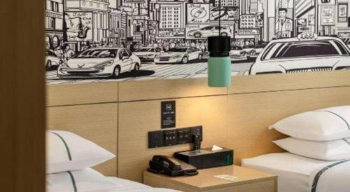 Katil atau katil-katil dalam bilik di City Comfort Inn Luocheng Bus Terminal