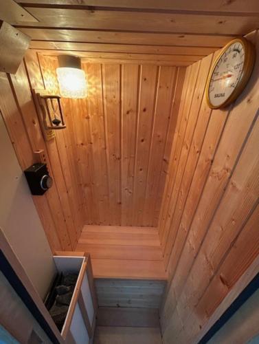 an overhead view of a sauna with a clock on the wall at 一棟貸しゲストハウス マリドール in Izumo