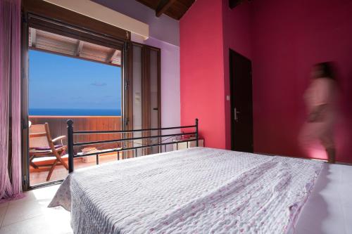 Ένα ή περισσότερα κρεβάτια σε δωμάτιο στο Tajo VIllas