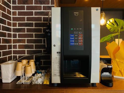 a microwave oven sitting on top of a counter at HOTEL TABARD TOKYO - Vacation STAY 64570v in Tokyo