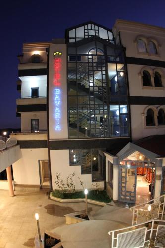 a building with a sign on the side of it at Hotel Bavaria Trogir in Trogir