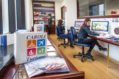 two women sitting at a desk in an office at Hotel Bellavista Club-Caroli Hotels in Gallipoli