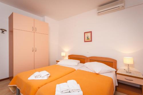Postel nebo postele na pokoji v ubytování Guest House Davor Tomas