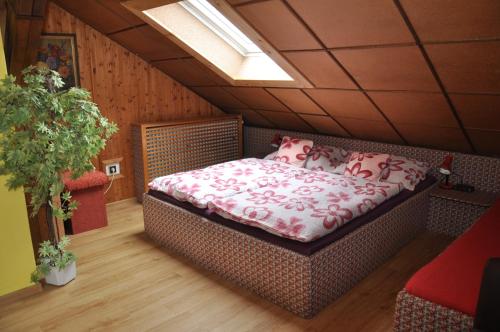 a bedroom with a bed in a room at Pension Nika in Český Krumlov