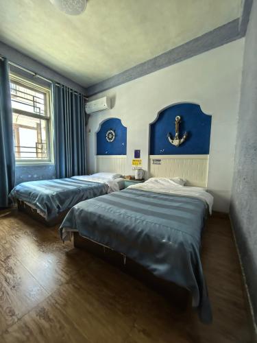 Postel nebo postele na pokoji v ubytování PI Network Inn