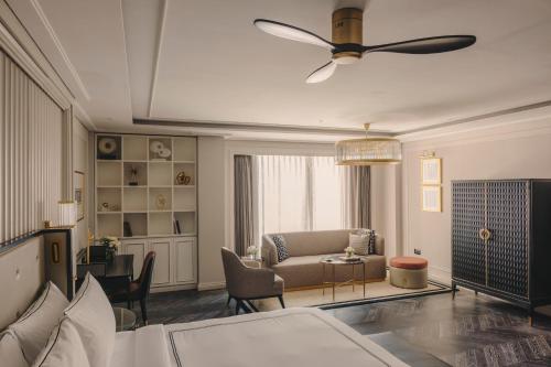 a living room with a couch and a table at Fairmont Mumbai in Mumbai