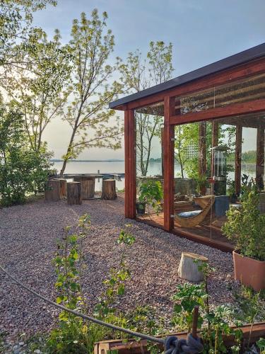 a house with a view of the water at Cozy river-view suite in Šamorín