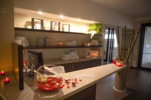 a room with a desk with a fish bowl on it at Hotel Degli Ulivi in Ferrandina
