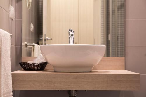 a bathroom with a bowl sink on a counter at Hotel Degli Ulivi in Ferrandina