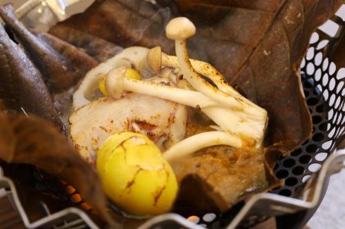 a basket full of food with mushrooms and meat at KAMENOI HOTEL Itako in Itako
