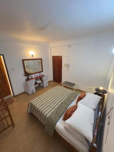 Postel nebo postele na pokoji v ubytování Paradise Inn