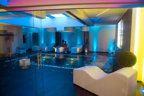 a living room with a pool in the middle at Hotel Degli Ulivi in Ferrandina