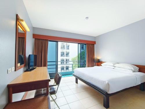 Postel nebo postele na pokoji v ubytování C & N Hotel Patong, Phuket