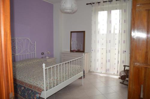 Un pat sau paturi într-o cameră la Il Melograno
