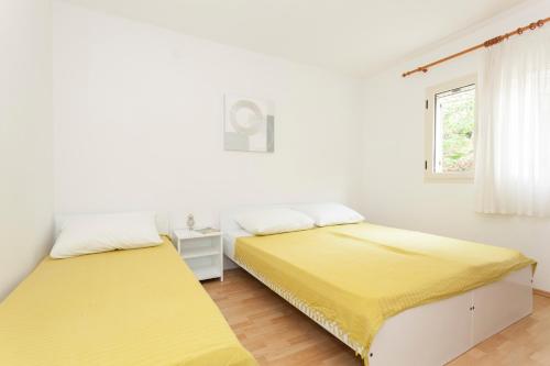 Apartments Adriasol tesisinde bir odada yatak veya yataklar