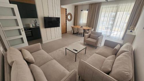 a living room with a couch and a table at Bella Vista Pleasure in Baošići