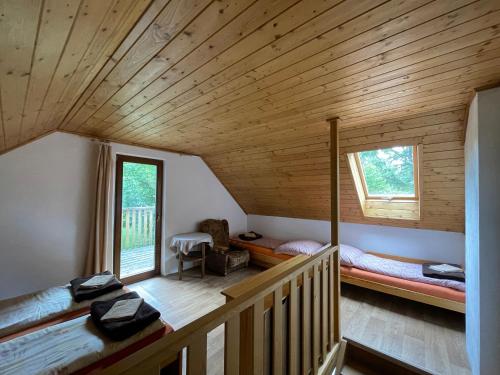 a room with two bunk beds in a house at Chata pod Javořicí in Lhotka