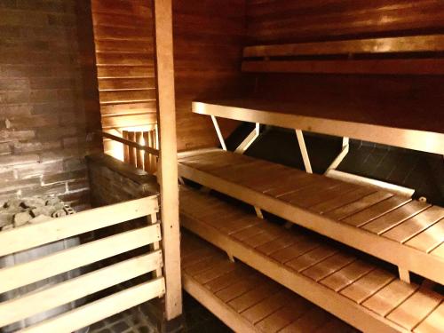 an empty room with wooden shelves in a cabin at Moomin Lover Home in Central Helsinki - Pool & Sauna in Helsinki