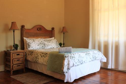 Postel nebo postele na pokoji v ubytování khaya4u Guesthouse