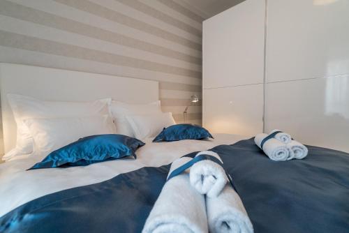 a bed with two stuffed animals laying on it at Villa Solis in Split