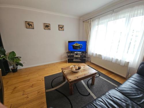 a living room with a couch and a coffee table at 2 Bedrooms - 3 Beds - Free Parking - 168 in Stanwell