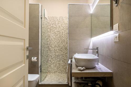 a bathroom with a sink and a shower at Sangiorgio Resort & Spa in Cutrofiano