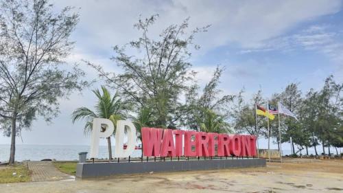 a sign that says pay water front in front of the ocean at PD D'Wharf The Bay Superior Queen Room SeaView Balcony in Port Dickson
