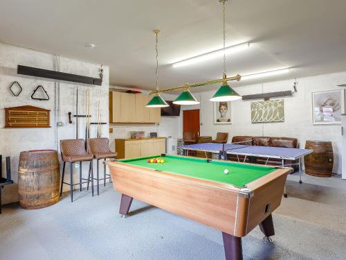 a room with a pool table and some chairs at Ard Taigh in Stron-fearnan