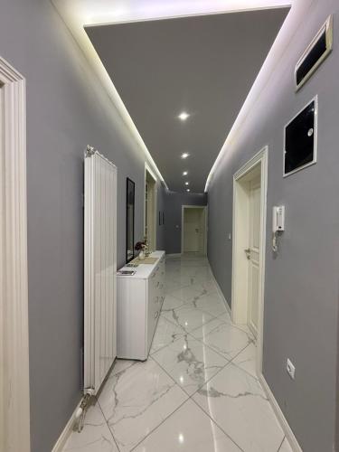 a large bathroom with a sink and a mirror at Latin Bridge Residence in Sarajevo