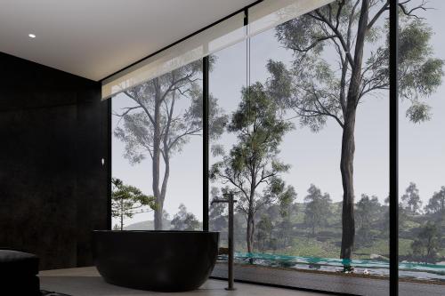 a bathroom with a large window with a tub and trees at The Ruler Cabin in Penginyahan