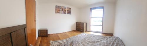 a bedroom with a bed and a window at Room with King Single bed in Melbourne