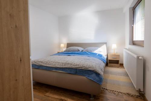 Ένα ή περισσότερα κρεβάτια σε δωμάτιο στο Apartman Ria