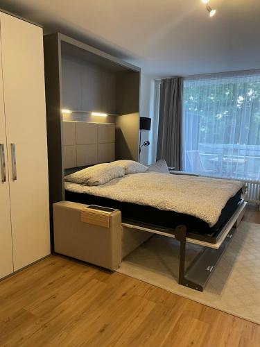a bedroom with a large bed in a room at Kleine BergZeit in Sankt Andreasberg