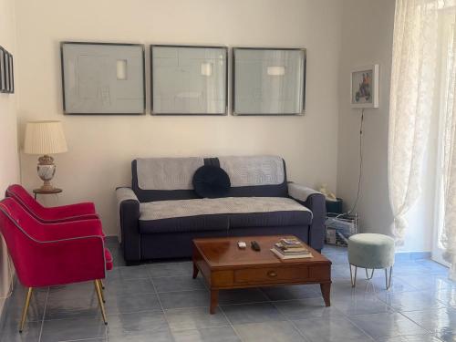 a living room with a couch and a table at Acquamarina in Agropoli