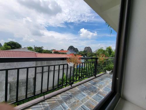a view of the water from a balcony at Tam Coc Gold Smile Homestay in Vũ Lâm
