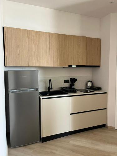 Η κουζίνα ή μικρή κουζίνα στο Emera Apartments