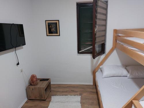 Postel nebo postele na pokoji v ubytování Aparmani Mitic