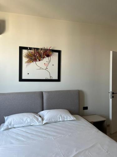 Ένα ή περισσότερα κρεβάτια σε δωμάτιο στο Emera Apartments